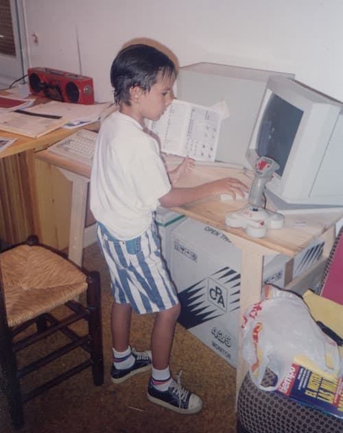 Young Manel playing computer games